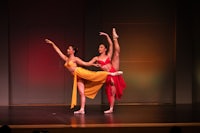two female dancers performing on stage